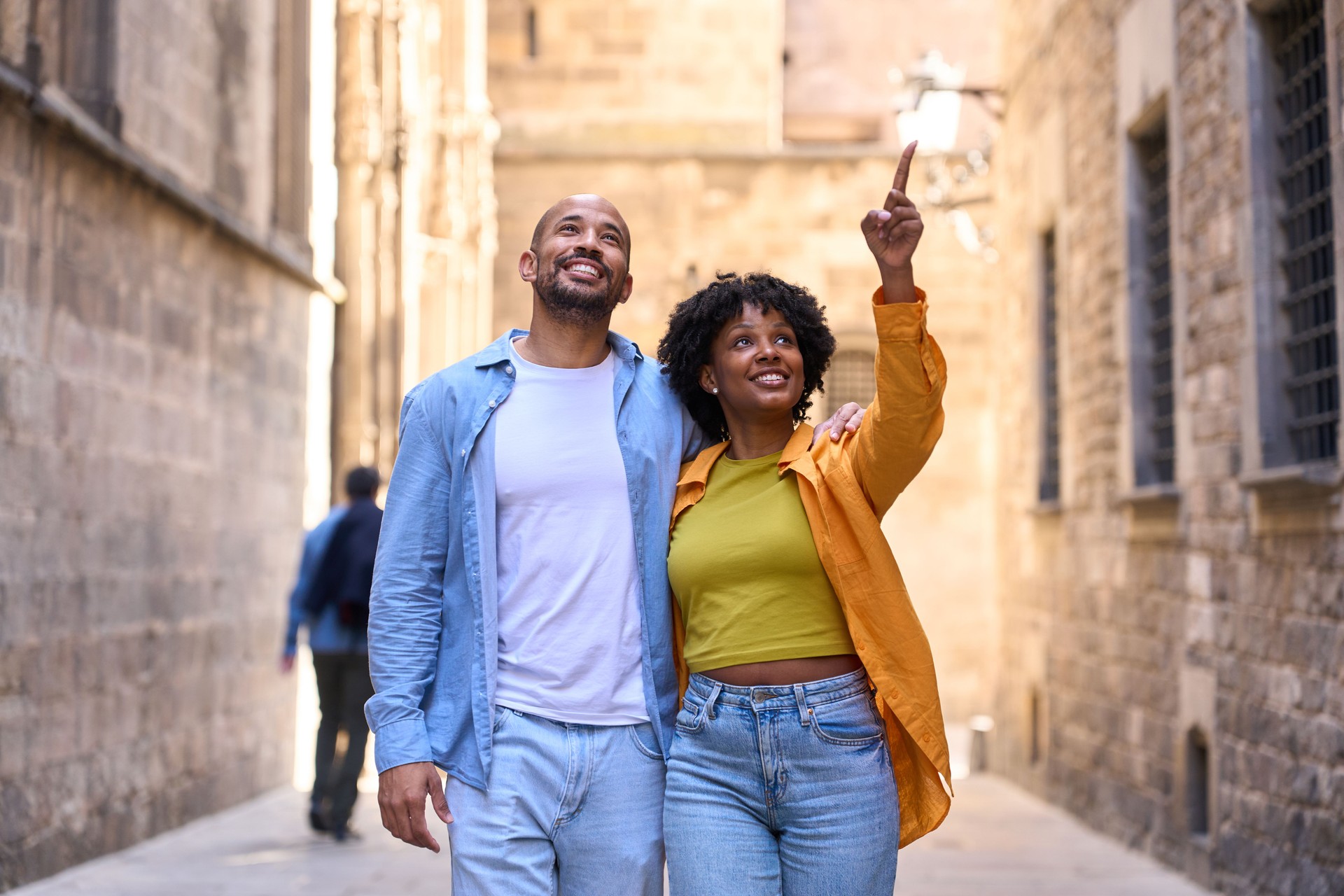 Tourists exploring barcelona, discovering gothic quarter's charm